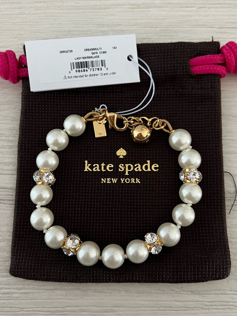 Kate Spade Lady Marmalade Pearl, Crystal, and Gold Bracelet